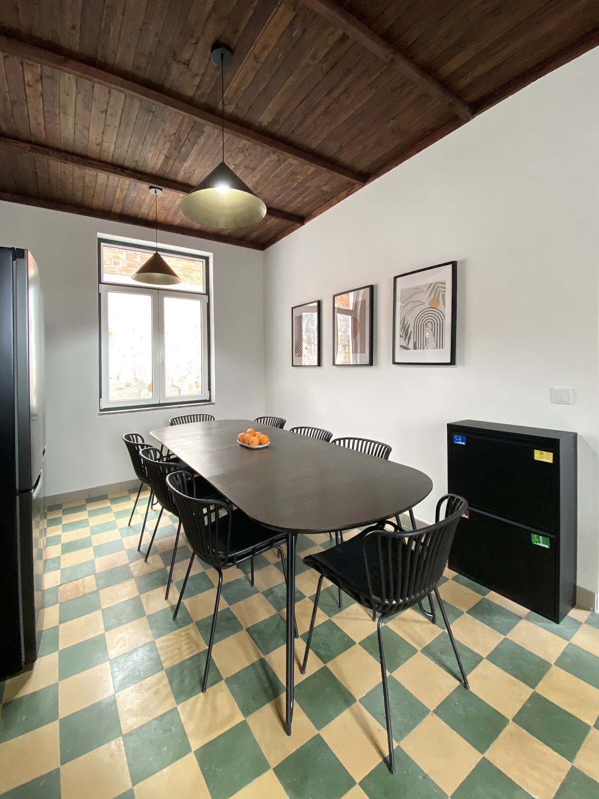 Shared dining area with long dark table