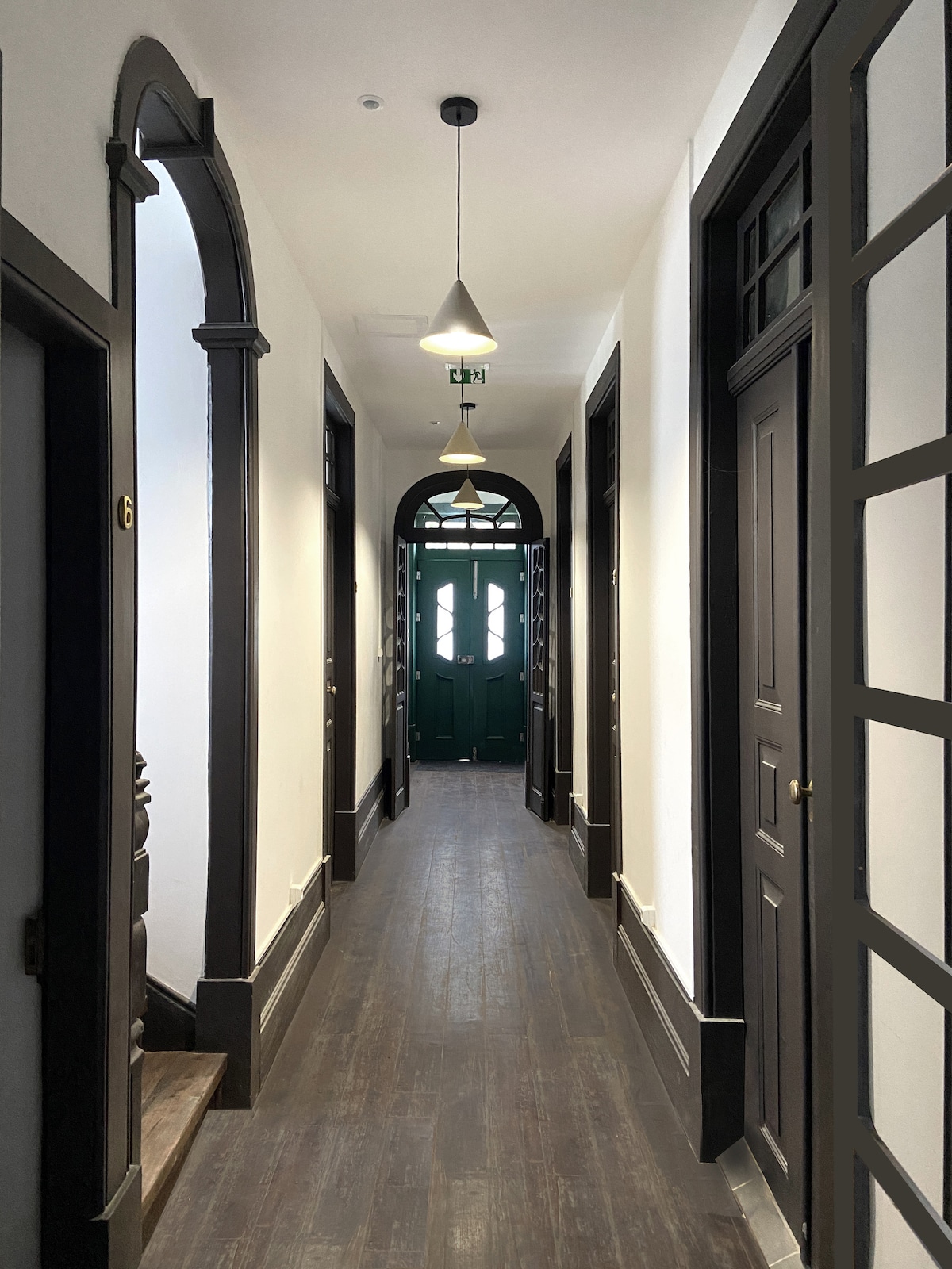 Central hallway with arched doorways