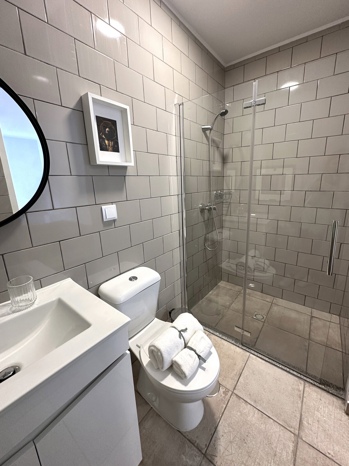 Bathroom with subway tile and walk-in shower