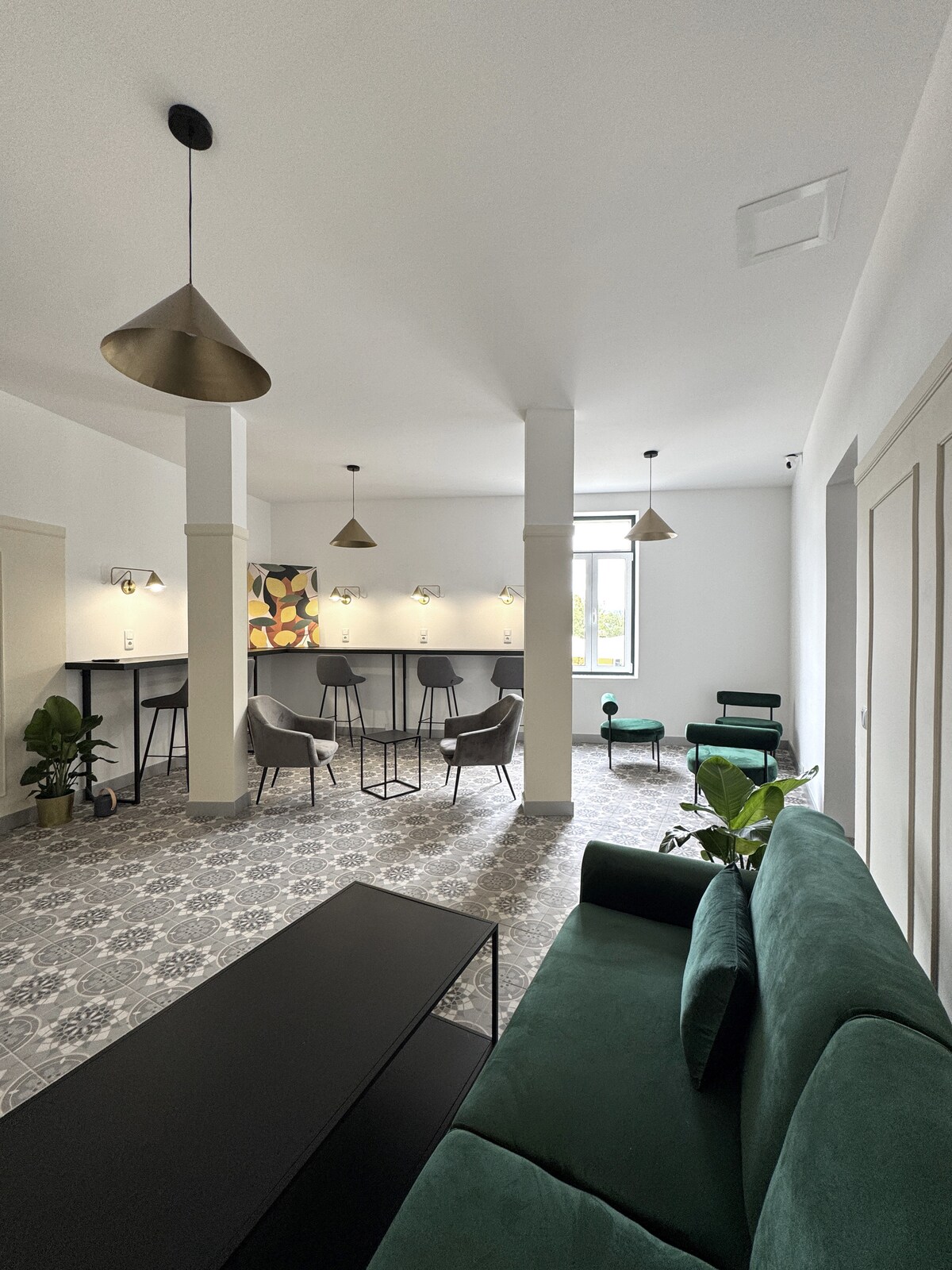 Wide shared lounge with bar and seating