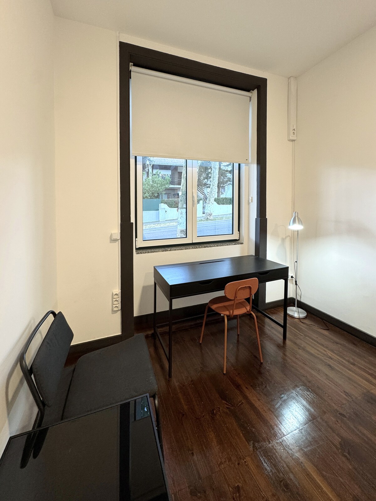 Workspace with desk and chair by window