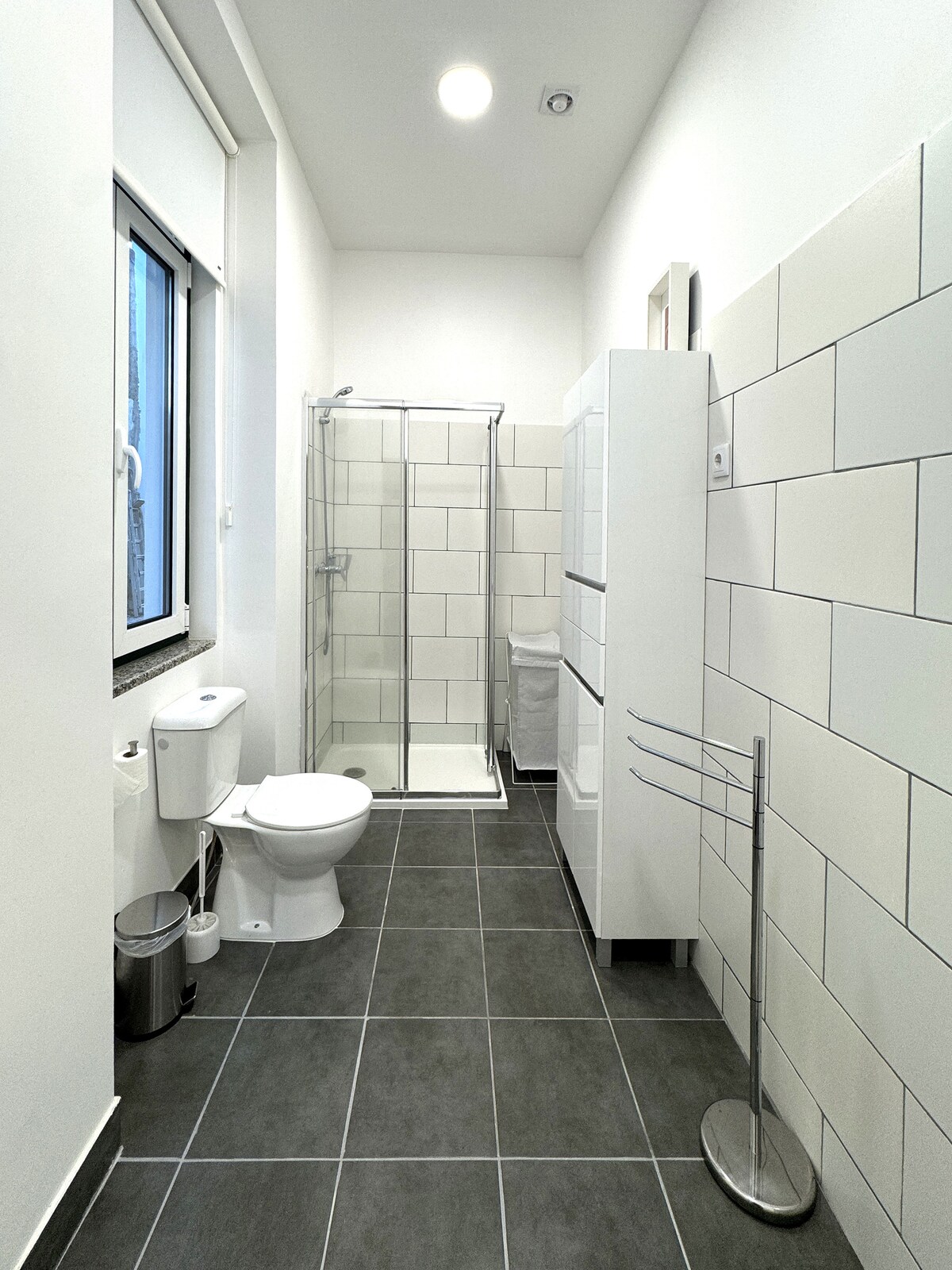 Long narrow bathroom with shower